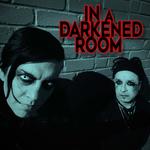 IN A DARKENED ROOM